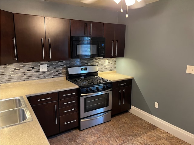 kitchen with dark brown cabinets, sink, backsplash, and stainless steel gas range oven