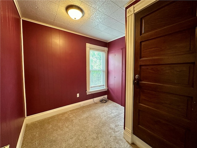 doorway featuring light colored carpet