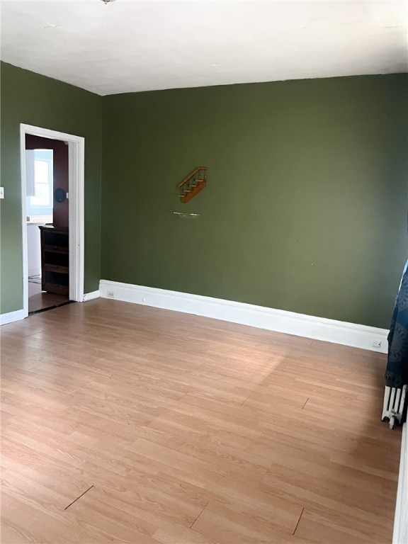 unfurnished room featuring light hardwood / wood-style flooring