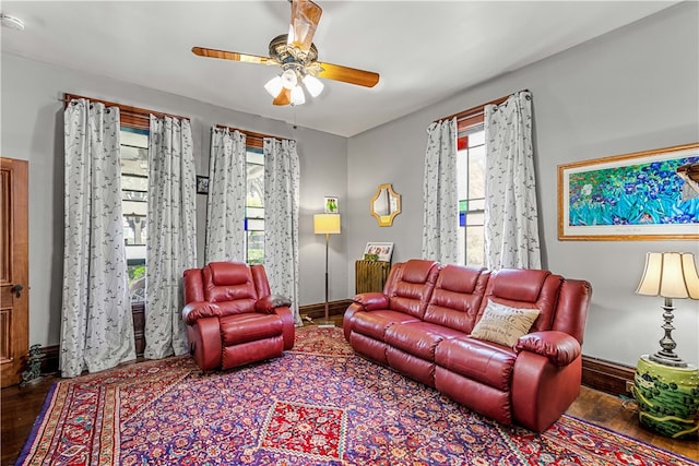 living room with ceiling fan, hardwood / wood-style flooring, and a healthy amount of sunlight