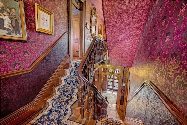 stairway with a towering ceiling