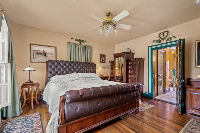 bedroom with ceiling fan and dark hardwood / wood-style flooring