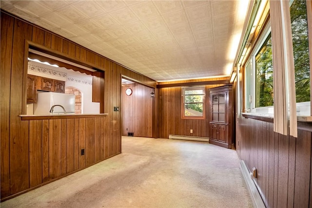 314 Lunn Blvd, Farrell, PA 16121 - interior space with carpet flooring, wood walls, and a baseboard heating unit