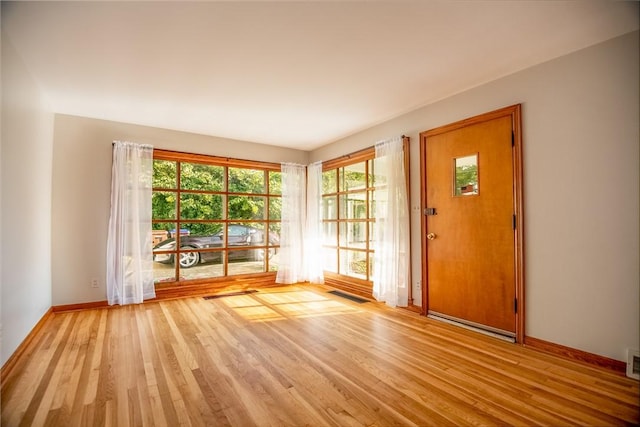 314 Lunn Blvd, Farrell, PA 16121 - doorway to outside with baseboards, visible vents, and light wood-style flooring