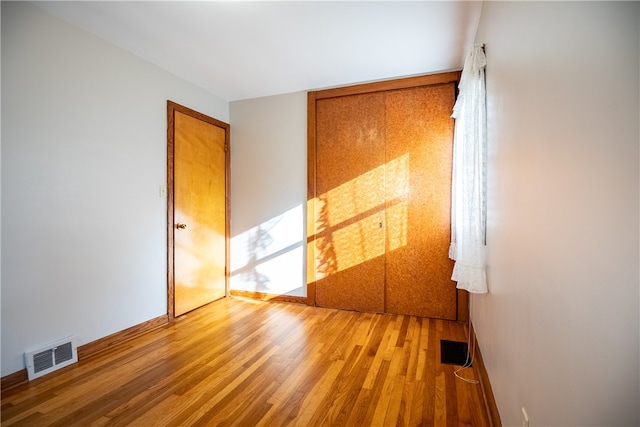 spare room featuring light wood-type flooring