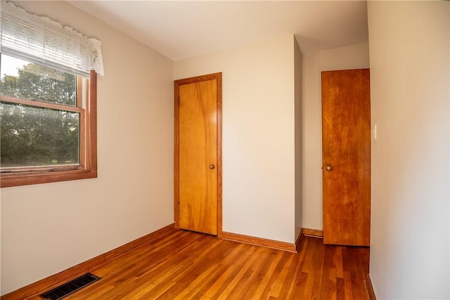 314 Lunn Blvd, Farrell, PA 16121 - unfurnished bedroom featuring baseboards, visible vents, and wood finished floors