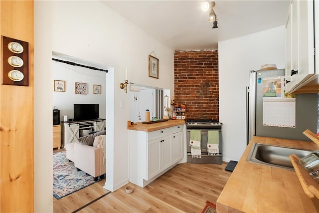 interior space featuring light wood-type flooring and sink