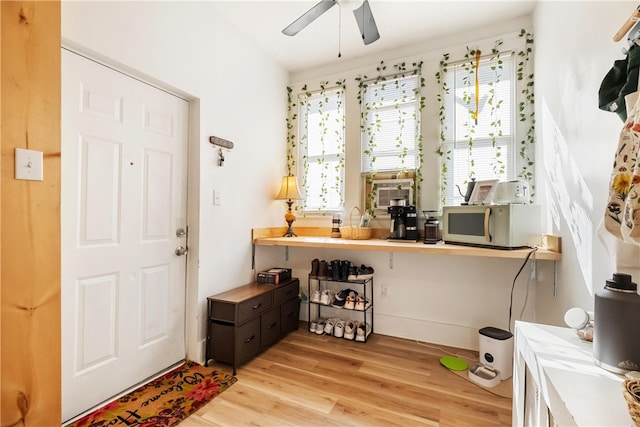 interior space with ceiling fan and light wood-type flooring