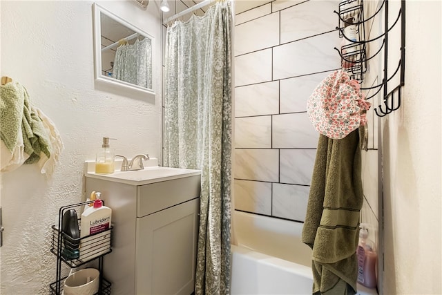 bathroom featuring vanity and shower / bath combo with shower curtain