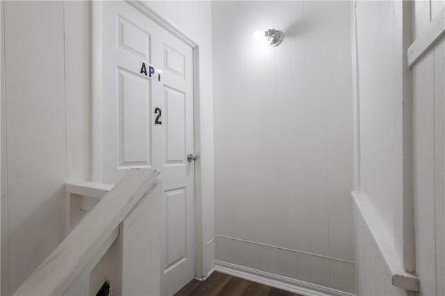mudroom with dark wood-style floors
