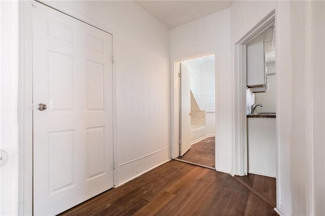 hallway featuring dark wood-style flooring