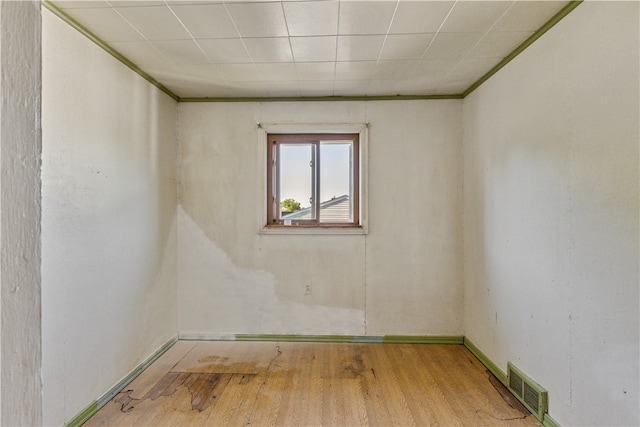 empty room with light hardwood / wood-style flooring