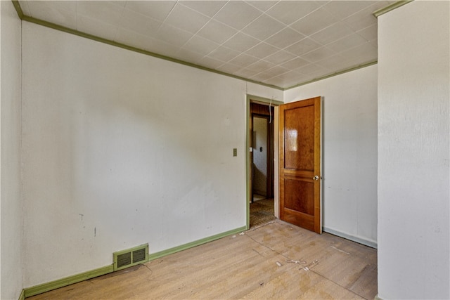 spare room featuring light wood-type flooring