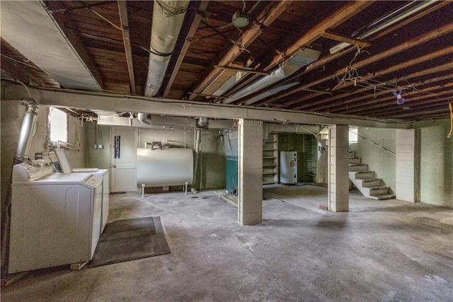 basement with gas water heater and independent washer and dryer