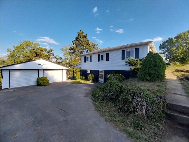 view of front facade with a garage and an outdoor structure