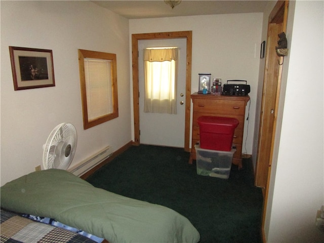 carpeted bedroom featuring a baseboard radiator