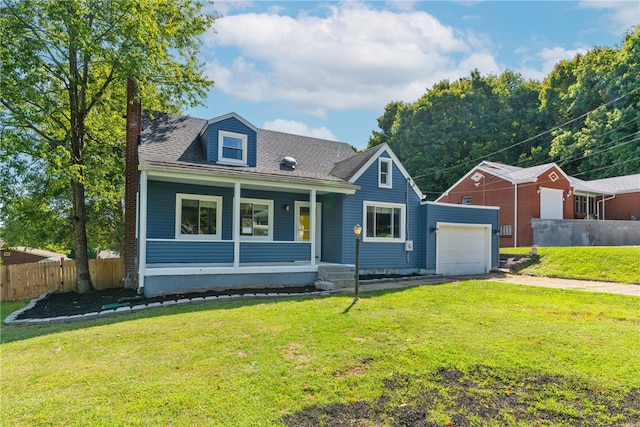 view of front facade with a porch, a front lawn, and a garage