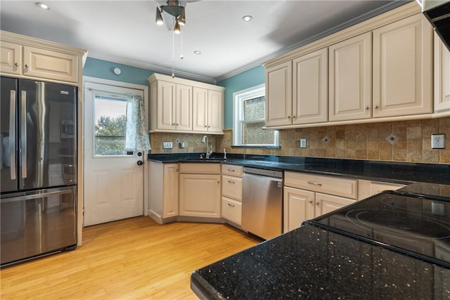 17 Long St, Hanover Twp Wsh, PA 15021 - kitchen with stainless steel appliances, a sink, light wood-style floors, cream cabinets, and ornamental molding