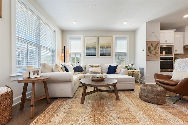 living room with light hardwood / wood-style flooring