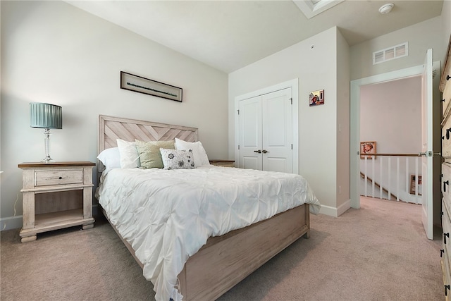 carpeted bedroom with a closet