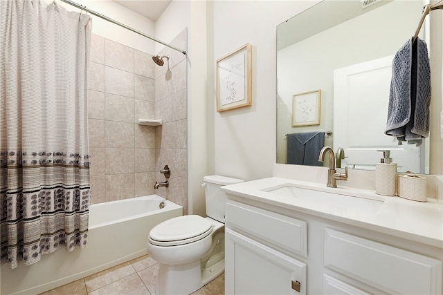 full bathroom featuring vanity, toilet, tile patterned floors, and shower / bath combo with shower curtain