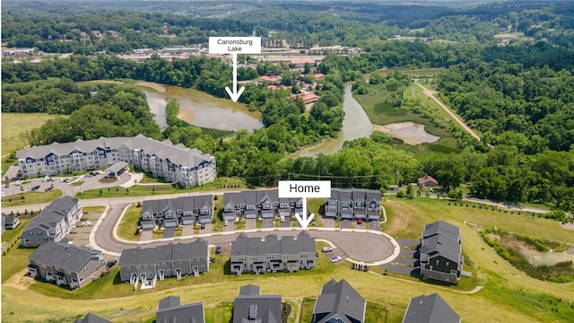 birds eye view of property with a water view