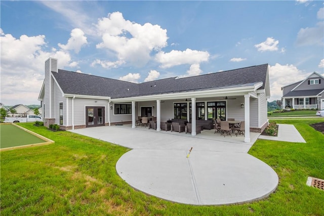 409 Spruce Ln, North Strabane, PA 15317 - rear view of property featuring a lawn, a patio, roof with shingles, french doors, and a chimney