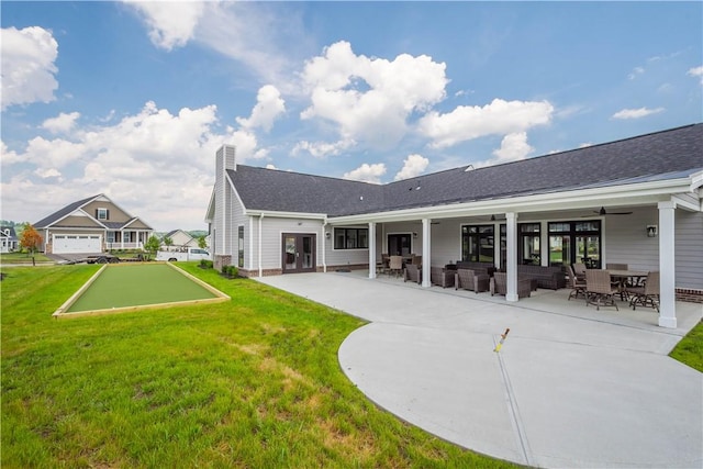 409 Spruce Ln, North Strabane, PA 15317 - back of house with a yard, an outdoor living space, a chimney, a shingled roof, and a ceiling fan