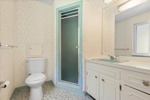 bathroom with toilet, tile patterned floors, vanity, and a shower with door