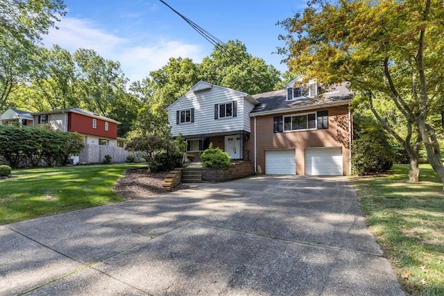 view of front of house with a garage and a front yard