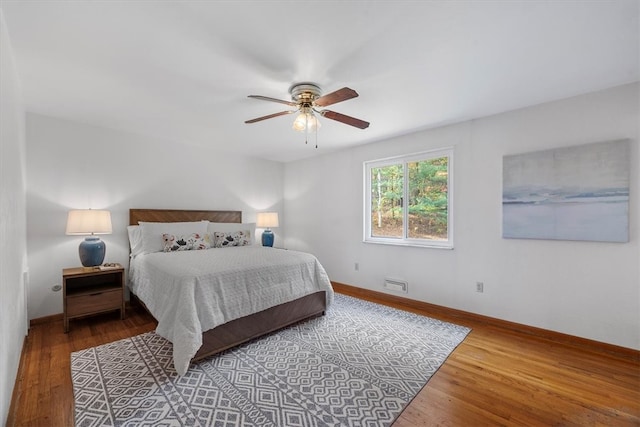 bedroom featuring wood-type flooring and ceiling fan