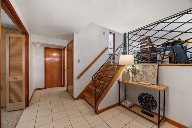 staircase with tile patterned flooring