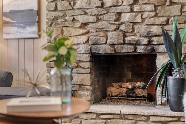 interior details with a stone fireplace