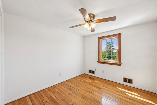 spare room featuring ceiling fan and light hardwood / wood-style floors