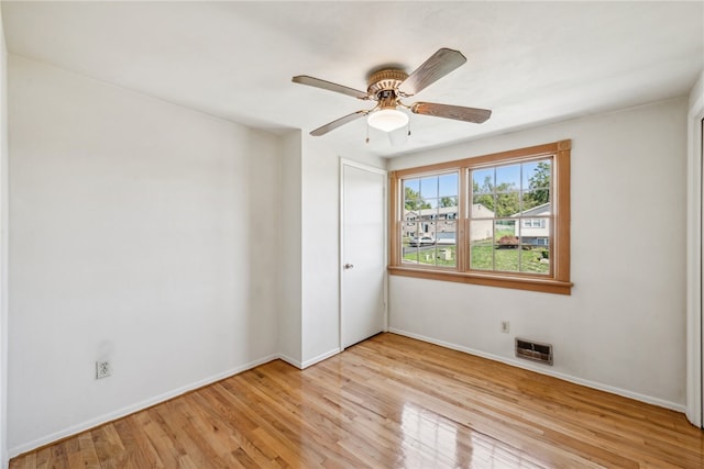 spare room with ceiling fan and light hardwood / wood-style floors