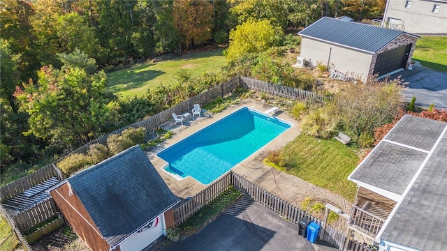 view of pool with an outdoor structure and a patio area