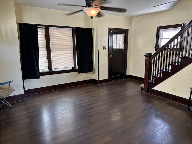 entryway with dark wood-type flooring and ceiling fan