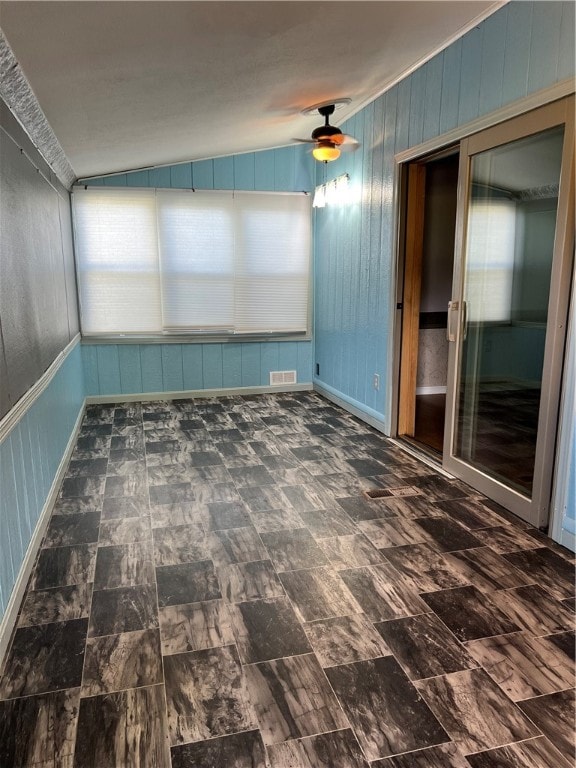 spare room with lofted ceiling and ceiling fan