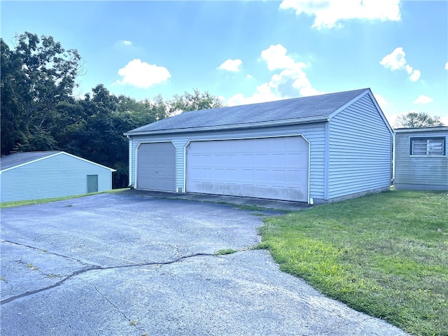 garage with a yard