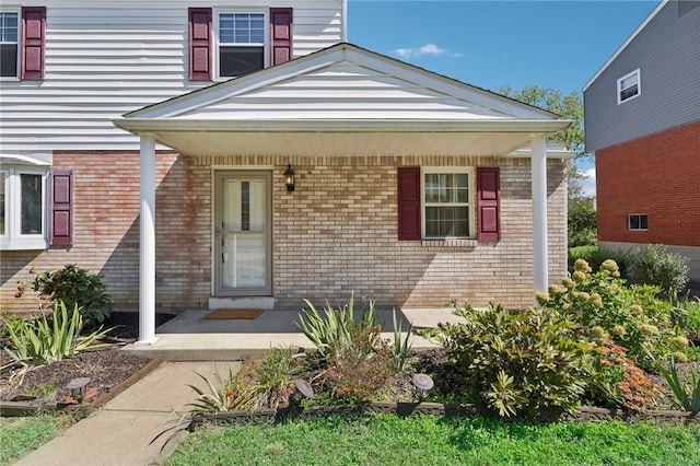 doorway to property featuring a porch