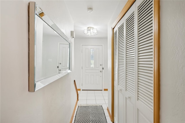 corridor with light tile patterned floors