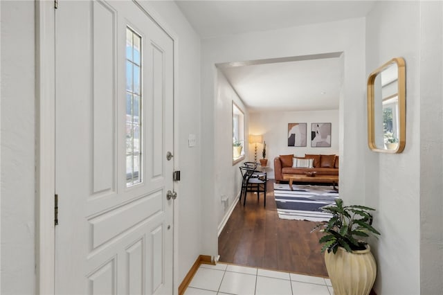 entryway featuring plenty of natural light and light hardwood / wood-style flooring