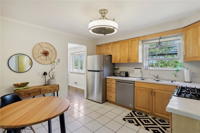 kitchen featuring light tile patterned floors, stainless steel appliances, crown molding, and sink