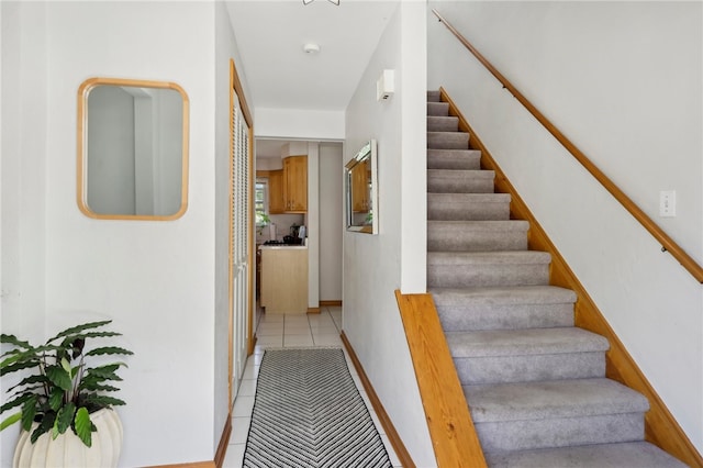 stairs with tile patterned floors