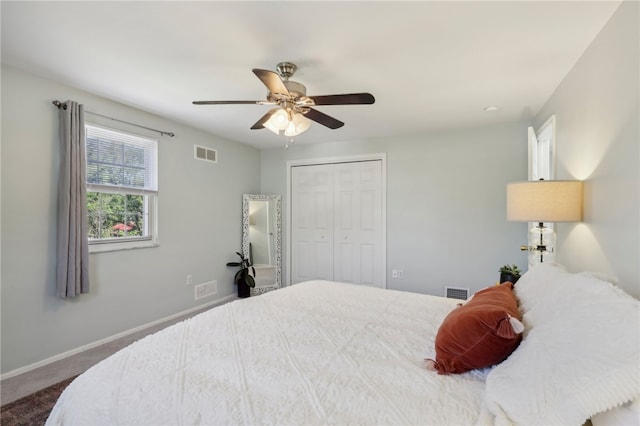 bedroom featuring a closet, ceiling fan, and carpet floors