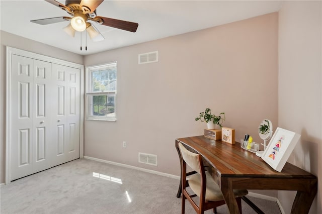 carpeted office with ceiling fan