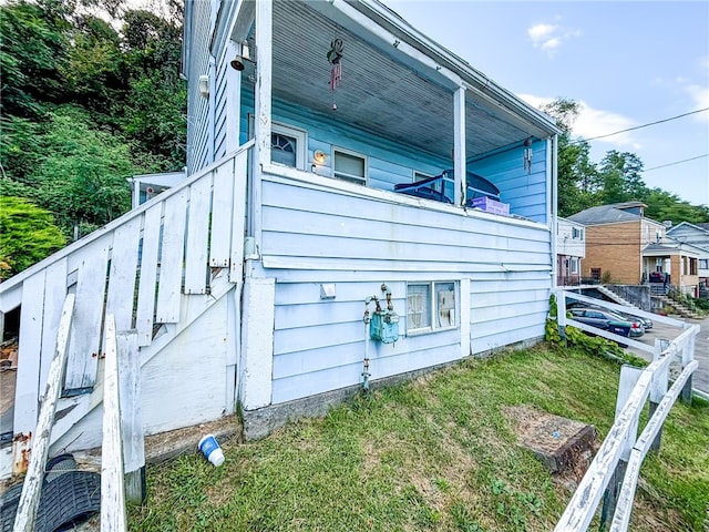 view of home's exterior featuring a yard