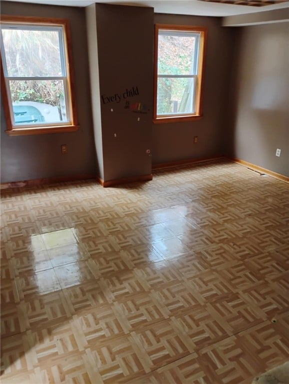 empty room with light parquet flooring