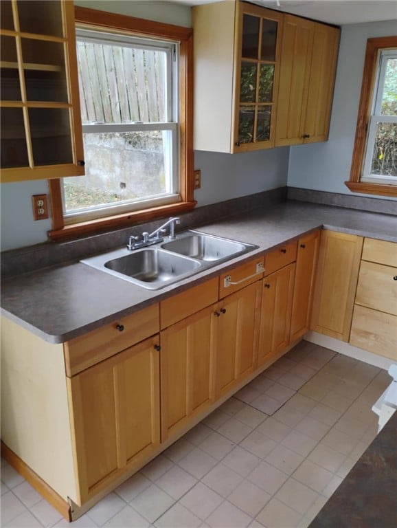 kitchen with sink and light tile patterned flooring