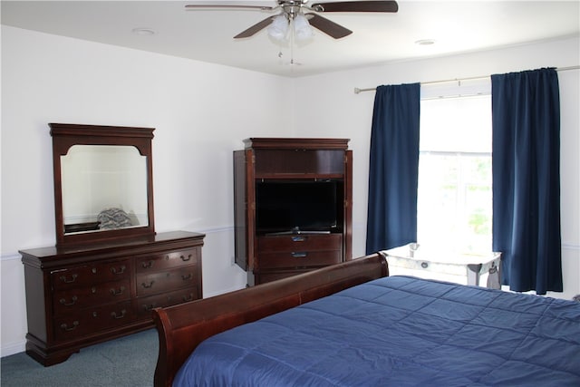 carpeted bedroom with ceiling fan